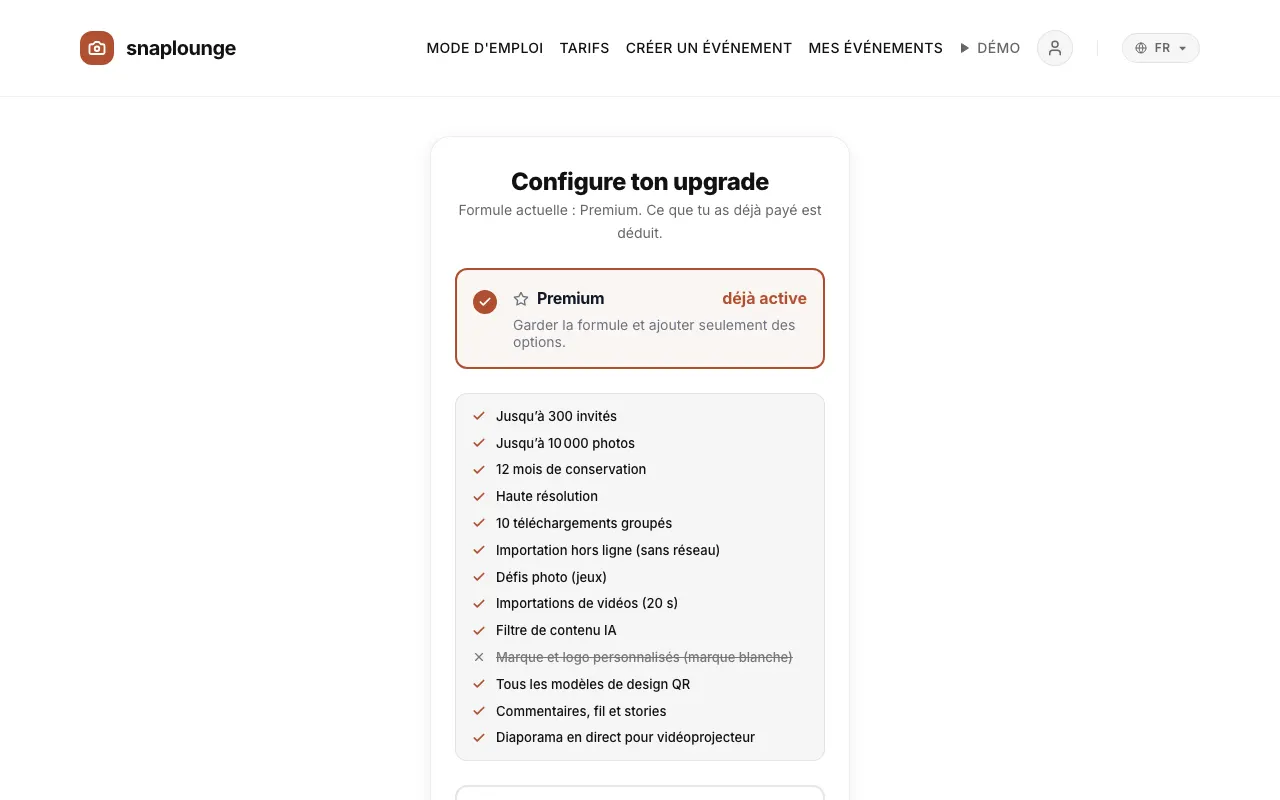 Image de l’app: Avec une formule payante, « Configure ton upgrade » s’ouvre : choisis la formule et ajoute, si tu le souhaites, des extras – « +12 mois de téléchargement » (19,99 €) ou « +200 invités et stockage » (14,99 €).